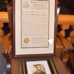 A photo of William Herbert Johnson with a framed certificate admitting him to the New York State Bar Association. | Brenda Muhammad, Staff Photographer