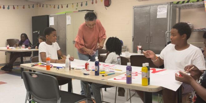 Rhonda Davis teaches an art class this summer at the Boys & Girls Club of Syracuse. Photo by Za’Tozia Duffie