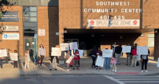 Protesters in front of the Southwest Community Center. The protesters want to know why a popular afterschool program was suddenly canceled and are demanding that the program re-start as soon as possible. Photo by Za'Tozia Duffie